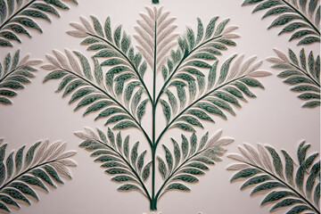 Close up of a white wall with green and white leaf patterns arranged symmetrically and repeating design