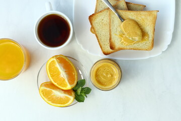 Tasty breakfast with toasts on table