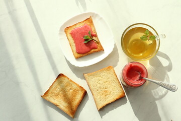 Tasty breakfast with toasts on table