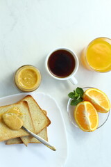 Tasty breakfast with toasts on table