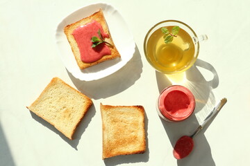 Tasty breakfast with toasts on table