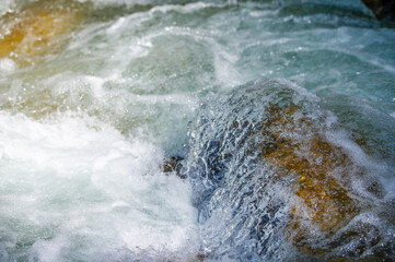 Immerse yourself in the beauty and tranquility of nature's symphony. Experience the soothing sounds of a mountain stream flowing over the rocks. Let your senses be captivated by the lush landscape.