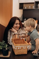 Mother and toddler joyfully explore kitchen playtime as the child scoops flour with focus and care captured moment reflects slow childhood parenting presence and learning through shared activity