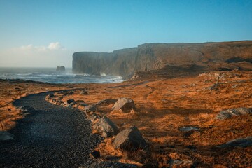 Visitors exploring Reynisfjara volcanic black beach