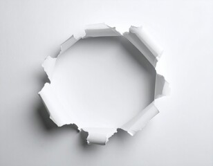 Round Hole in Paper with Torn Edges Isolated on White Background