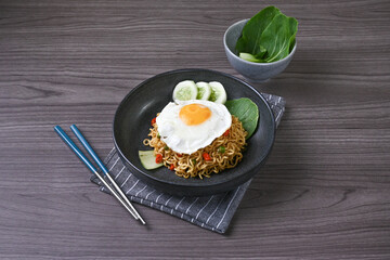 Fried Indomie is ready to serve complete with eggs and vegetables