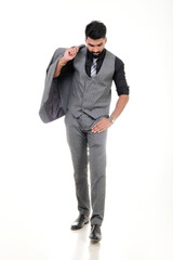 Fototapeta premium A man in an elegant gray suit with a tie and watch, a stylish business look on a white background.