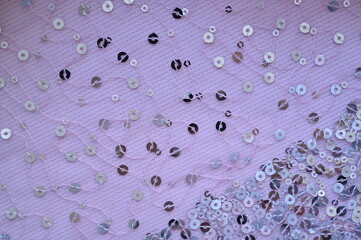 pink fabric with streaky sequins as a background, pink mesh fabric as a background	
