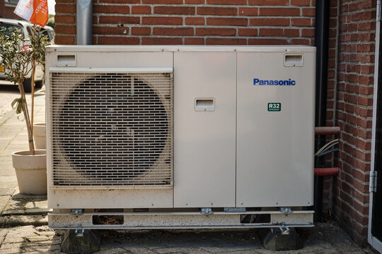 Panasonic heat pump unit on house wall in Oosterland, Zeeland, Netherlands