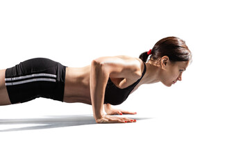 Beautiful woman at the gym doing fitness exercises. Sports transparent background. 