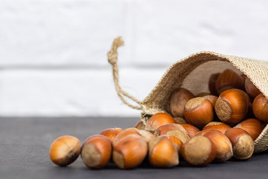 close up of hazelnuts on wooden table
