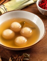Sweet rice balls in broth