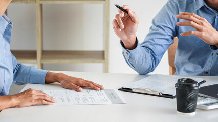Interviewer or Board reading a resume during job interview, Employer interviewing a young male job...