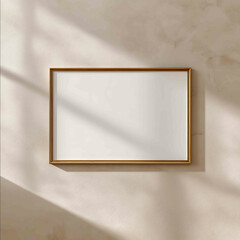 realistic mockup of an empty 32 horizontal picture frame hanging on a light beige wall frame is in landscape orientation thin vintage brass or antique gold m