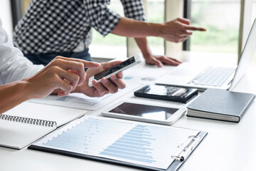 Business team meeting working with new startup project, discussion and analysis data the charts and graphs. Digital tablet, calculator, laptop computer using, Business finance and accounting concept