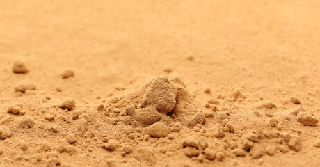 Red maca organic powder pile background and texture, side view	