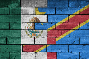 colourful painted big national flag of mexico and flag of democratic republic of the congo on a massive old brick wall background. concept