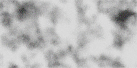 Abstract monochrome background with blurred gray and white textures resembling clouds or smoke effect.