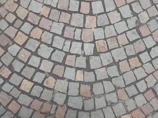 background. paving slabs originally laid out on the road.