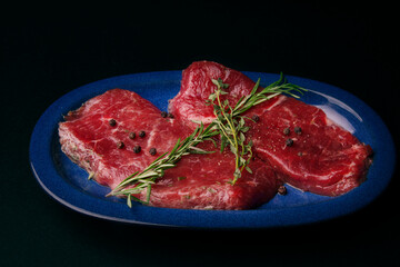 Raw Steaks on Blue Plate