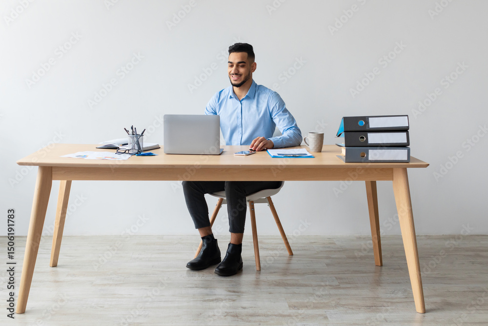 Aufkleber portrait of smiling middle eastern male manager working on laptop computer in modern office, cheerfu