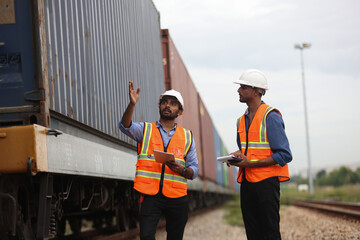 World wide logistic, The container cargo shipment by rail transportation , Logistic manager and staff working check container on rail way 