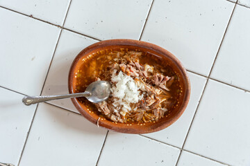 Tatemada birria served at a traditional stall in the central market of Guadalajara, Jalisco, Mexico. abastos, tapatio, chivo