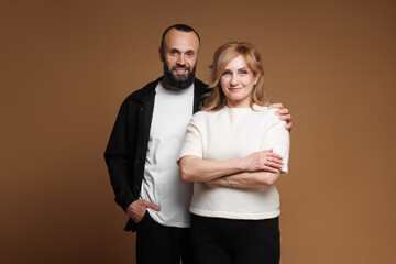 Portrait of lovely couple on brown background