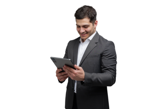 Engaging businessman in formal attire smiles while using a tablet in a modern office setting