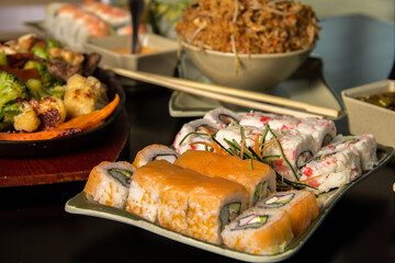 A colorful and appetizing platter featuring an assortment of sushi rolls, including shrimp and crab, perfect for showcasing Japanese cuisine in a vibrant way.