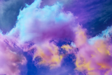 Fluffy color clouds floating in beautiful blue sky