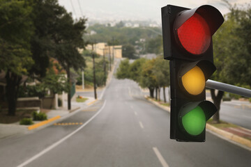 Traffic lights on empty road. Signaling device