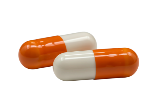 Two orange and white capsules isolated on transparent background