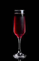 The glass of rose wine on a black background