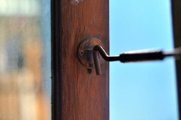 iron hook to hold the wooden window open