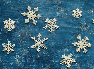 Festive snowflakes on a textured blue background