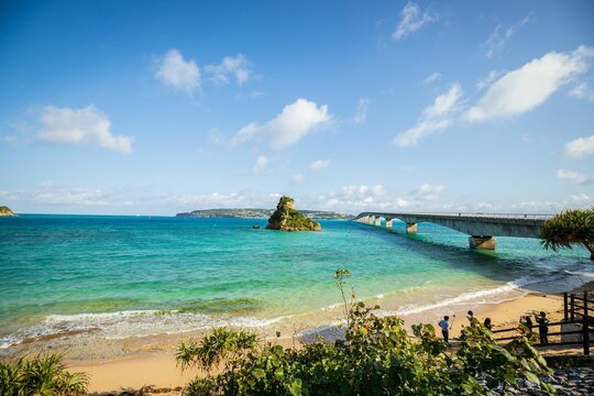 Scenic View of Kouri Island and Bridge from Okinawa Beach, Japan