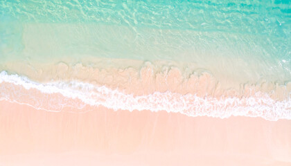 Seashore Serenity: Capturing the exquisite beauty where soft, pink sand meets the gentle embrace of crystal-clear ocean waves, with a sense of calm and tranquility.