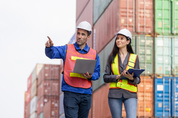 Engineers team managing cargo operations, Engineer and foreman dock worker checking containers box...