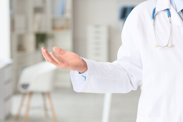 Male doctor showing his hand in clinic, closeup