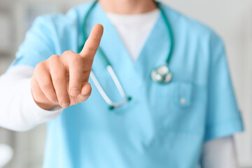 Male doctor using virtual screen in clinic, closeup