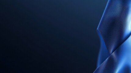 Deep blue fabric folds against a dark background.