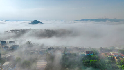 Aerial view of Xuan Tho suburbs near Da Lat city at morning with misty. This place is considered most beautiful and peaceful place to watch in highlands of Vietnam