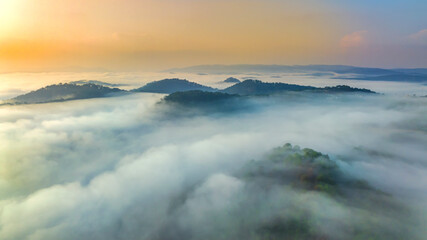 Obraz premium Aerial view of Xuan Tho suburbs near Da Lat city at morning with misty and sunrise sky. This place is considered most beautiful and peaceful place to watch sunrise in highlands of Vietnam