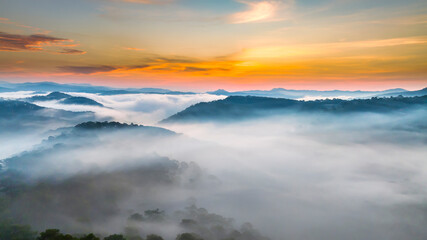 Aerial view of Xuan Tho suburbs near Da Lat city at morning with misty and sunrise sky. This place is considered most beautiful and peaceful place to watch sunrise in highlands of Vietnam