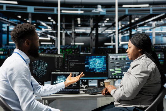 Server farm teamworking colleagues using AI algorithms categorizing and clustering unstructured data. Data center engineering team using Natural Language Processing tech to analyze information