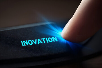 Activating innovation, a fingertip presses a luminescent button, symbolizing the start of a new technological era