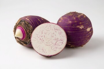 Obraz premium Taro Root : Fresh Purple Taro Root, Half Cut, on White Background. Cooking Ingredient, Healthy Eating.