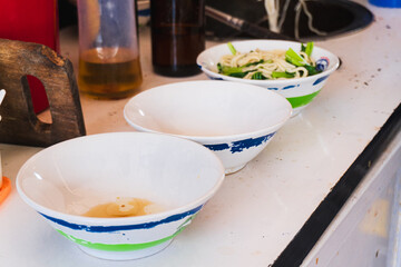 Preparing chicken noodles. View of a chicken noodle seller who is making chicken noodles for the buyer.