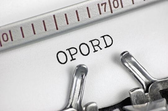 Operation order acronym OPORD text macro closeup, typewriter typed leader directive, coordinated military combat mission execution concept, large detailed horizontal retro document metaphor